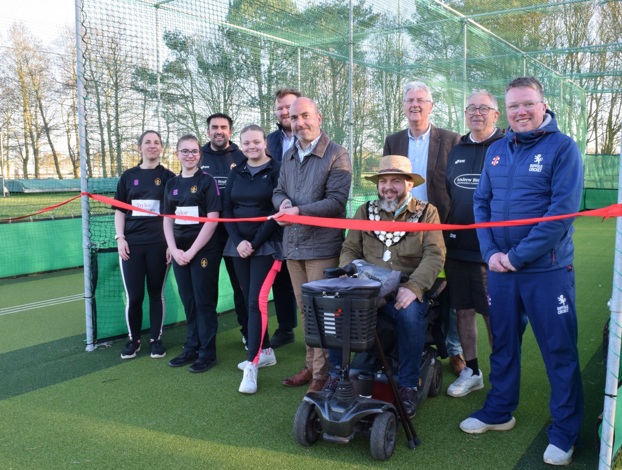 Mid Suffolk Cllr Tim Weller and Cllr Terence Carter, Stowmarket Town Council Mayor with Chairman Harry Griffiths and members of the Stowmarket Cricket Club.