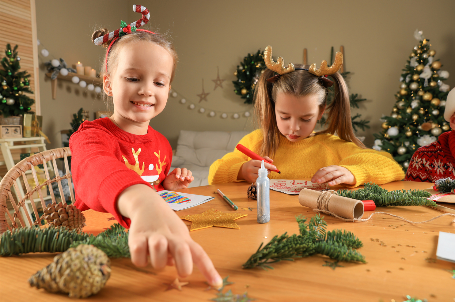 Children doing Christmas crafts.