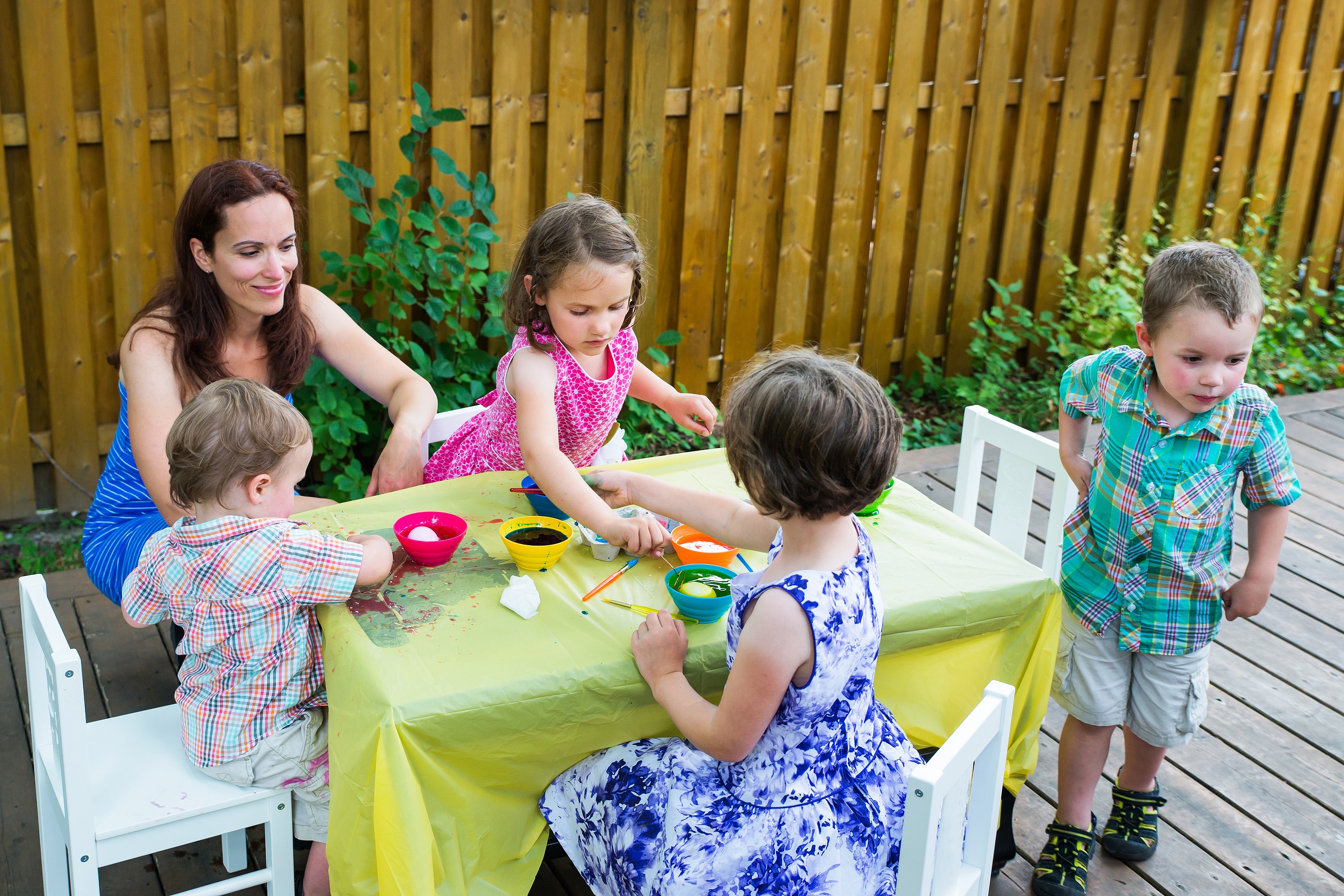 Children painting Easter eggs