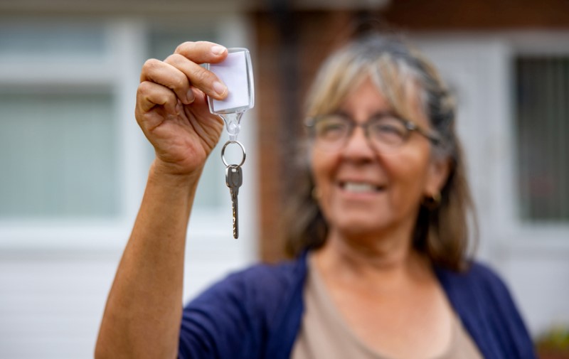 Lady holding house key